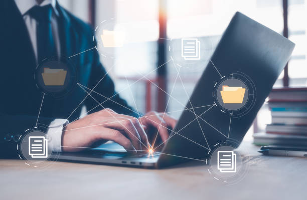 istock Document Management System (DMS) concept, businessman working on laptop computer in office.  managing corporate files and information 1476192969