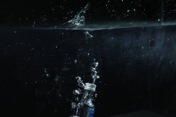 istock a Water bottle in water, Dropping a bottle in water 1476193199