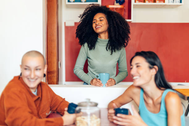 istock three girls talking in a guesthouse - young students sharing kitchen college - multiethnic young female people having fun with friends in a shared room 1476193634