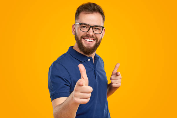 istock Happy man pointing at camera with index fingers 1476195005