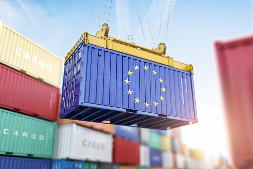 Cargo shipping container with EU European Union flag in a port harbor. Production, delivery, shipping and freight transportation of EU products concept. 3d illustration