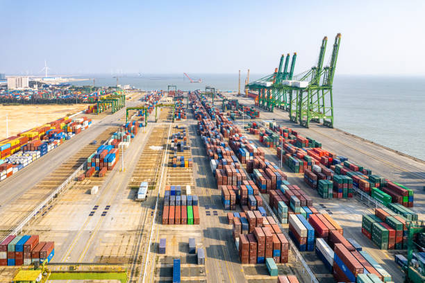 istock Containers stacked in international freight port 1476199237