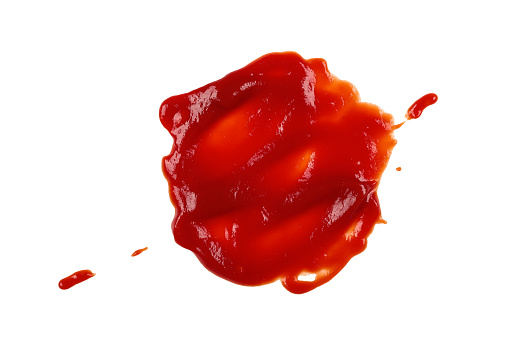 Close up wet stain of red ketchup tomato sauce isolated on white background, top view, directly above