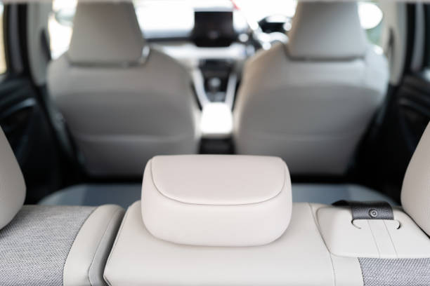 istock Shallow focus of rear headrest seen inside an empty car. 1476203519