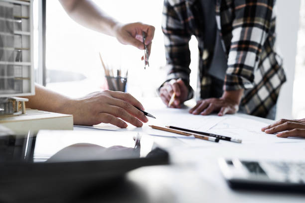 istock Team Work of Architect Engineer Design Working on Blueprint Planning Concept. Construction Concept 1476206283