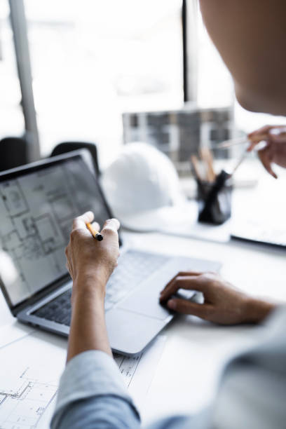 istock Vertical image team work of engineer meeting for architectural project. working with partner and engineering tools on workplace 1476206347