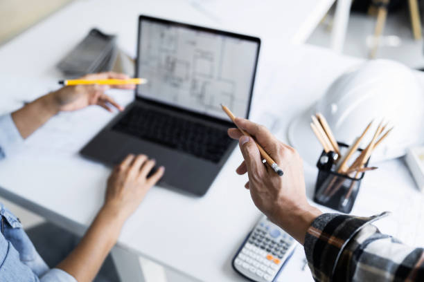 istock Image of engineer meeting for architectural project. working with laptop and engineering tools on workplace 1476206431
