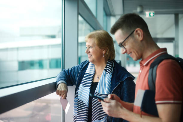 istock Passengers waiting at airport for boarding to airplane 1476210537
