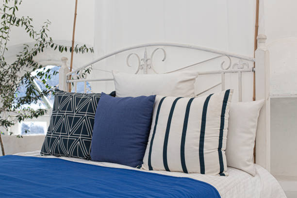 istock Blue pillow in the middle of king size bed 1476210884