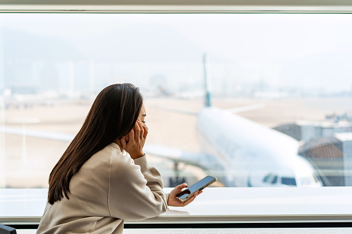 Upset and frustrated passenger waiting for flight delays for a long time