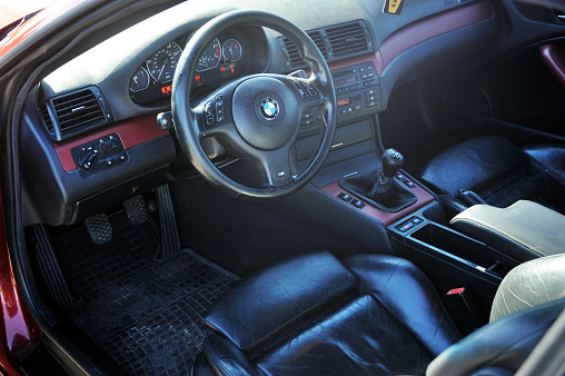 Belarus, Brest - August 04, 2019: BMW E46 sports car close-up of the dashboard and steering wheel.Photographing a modern car in the country on the highway.
