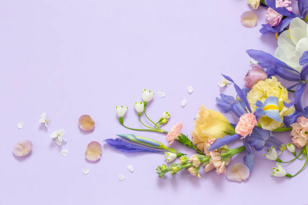 istock beautiful spring flowers on paper background 1476220367