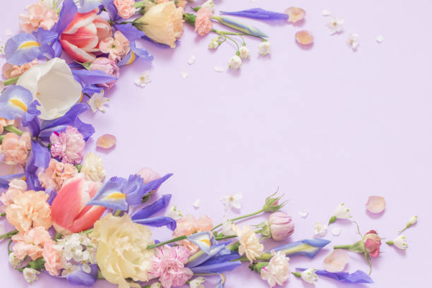 istock beautiful spring flowers on paper background 1476220391