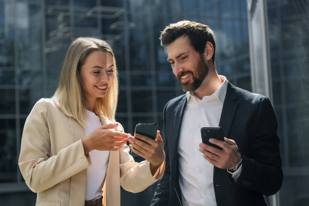 istock Colleagues discussing something and looking inloved and contented 1476222842