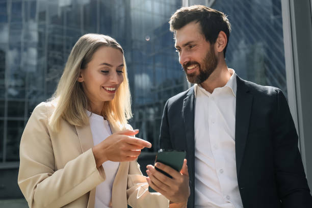 istock Colleagues discussing something and looking inloved and contented 1476222852