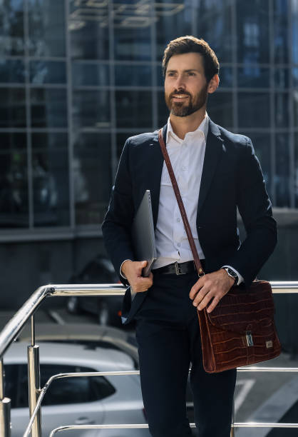 istock Bearded man in a stylish suit looking confident 1476222893