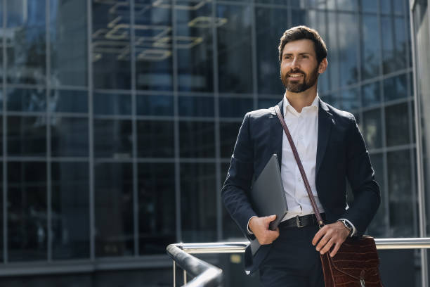 istock Bearded man in a stylish suit looking confident 1476222924