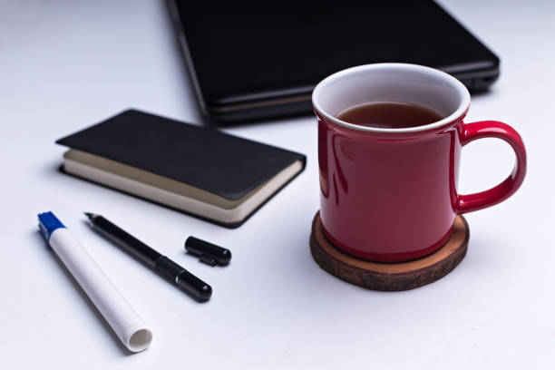 Flatlay of Tea break concept / coffee break after work, The break moment after working with wireless device, enjoying drink - Stock photo