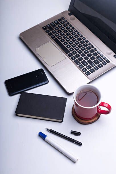 Flatlay of Tea break concept / coffee break after work, The break moment after working with wireless device, enjoying drink - Stock photo
