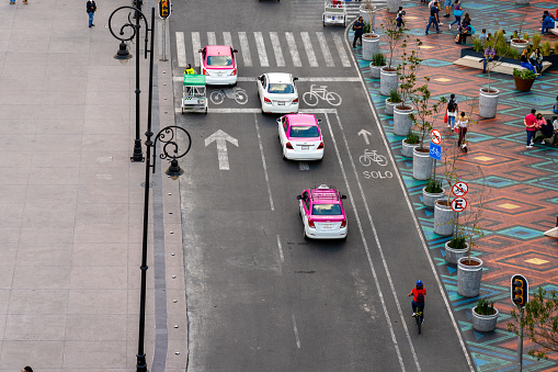 Mexico City Mexico - February 18 2022: Elevated View of Pink Taxi's Lined Up at a Traffic Signal in Mexico City Near Zocalo Square
