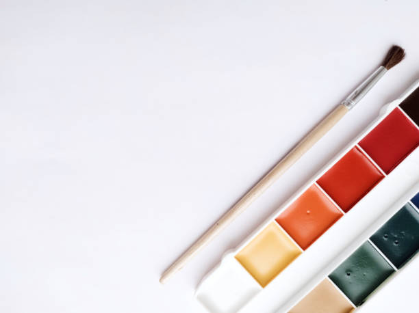 istock Brush and paint on a white background. Everything for drawing. Creation. Children are creativity. Hobby. Colored paints 1476227440