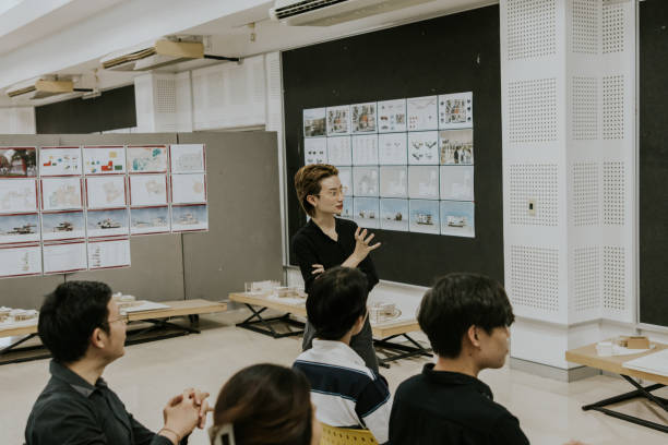 istock Asian Design teacher listening the student presents her work. 1476230362