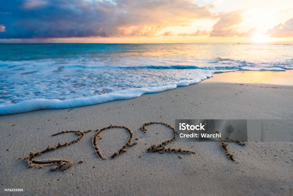 2024 year number handwritten on a sandy beach 2024 year number handwritten on a sandy beach at sunrise 2024 Stock Photo