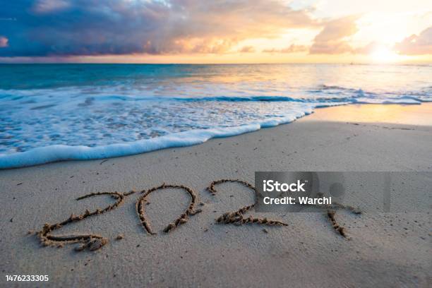 2024 Year Number Handwritten On A Sandy Beach Stock Photo - Download Image Now - 2024, New Year, New Year's Eve