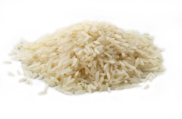 istock a small hill of rice grains on a white background 1476237619