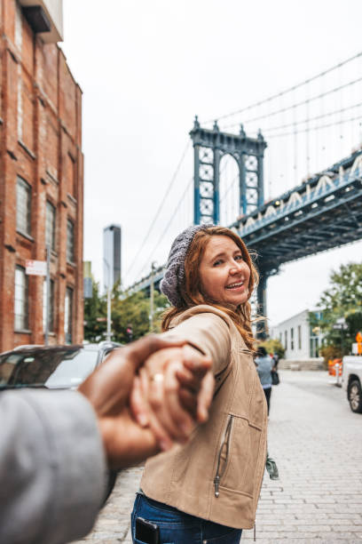 istock Couple walking down the streets discovering New York 1476237737