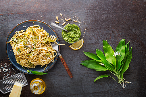 Making Fresh pasta with ramson or wild garlic pesto. Healthy spring food concept