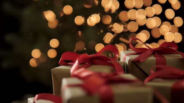 Christmas gifts with bokeh lights in the background