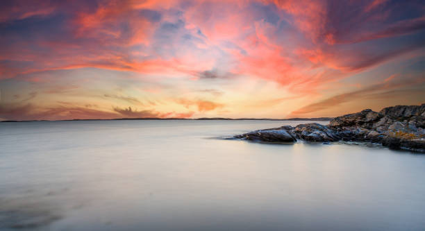 istock Coastal scene with sunset clouds, Sweden. 1476243062