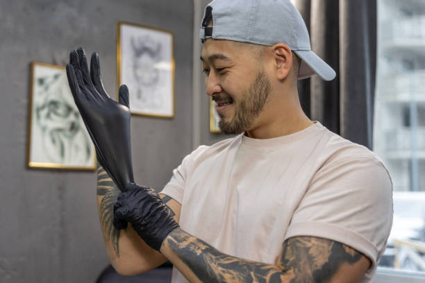 istock Young asian man putting on gloves 1476245739