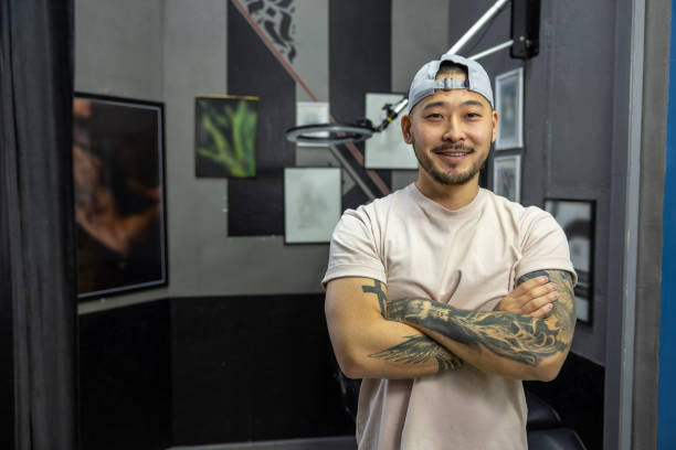 istock Asian young man in a tattoo salon 1476245914