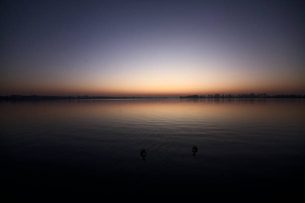 Lake  at sunset with sky casted in the water
