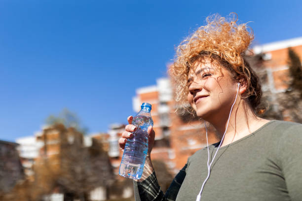 istock Young overweight woman taking a break 1476247315