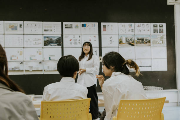 istock Two design student friends discuss about their friend's inspiration  design  space is really good, think out of the box. 1476248947