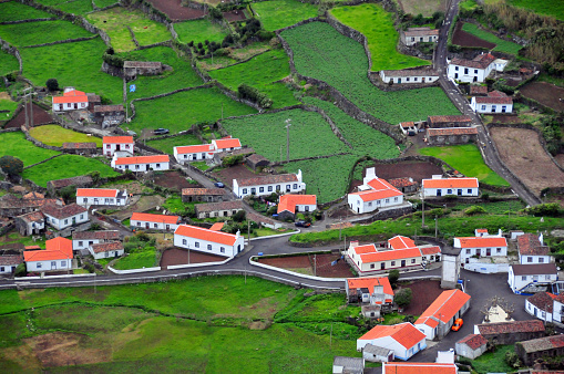 Fajãzinha, Flores Island, Azores, Portugal: overview of Fajãzinha, from Miradouro do Portal viewpoint - village houses and green plots of land fenced by wall of volcanic rock. This picturesque region, full of traditions, has also been blessed with amazing natural landscapes.