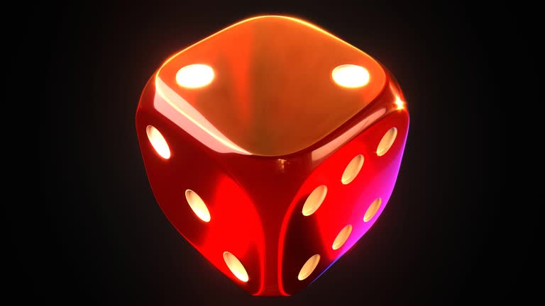 Shiny red dice on black background.