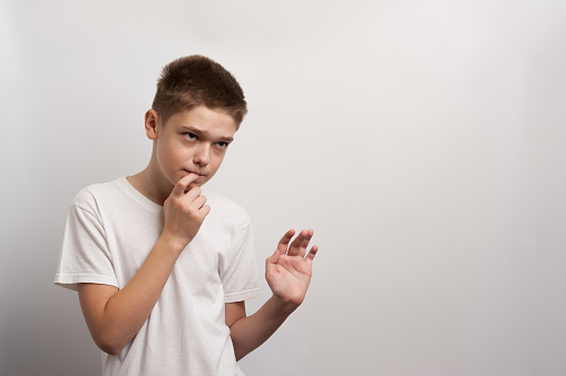 the teenager greets by showing his insecurity and shyness