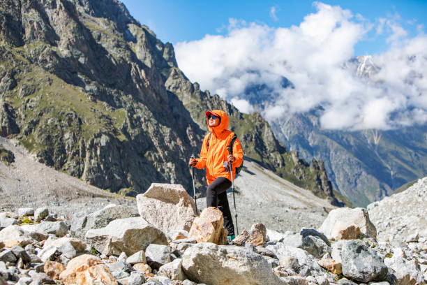 istock Young woman trekking in mountains 1476260862