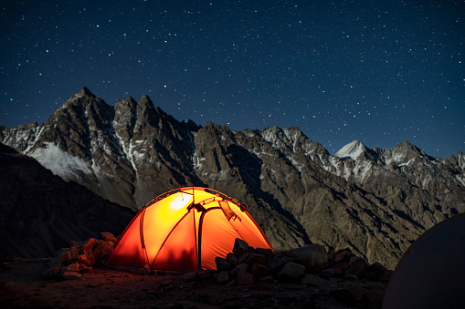 Tent in camping in mountains at night