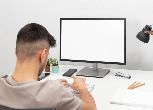 istock Young man working on computer in home office.education.business.e-commerce 1476262768