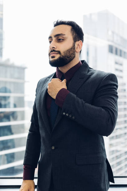 istock Smart businessman working in modern office. businessman standing in office. 1476264405