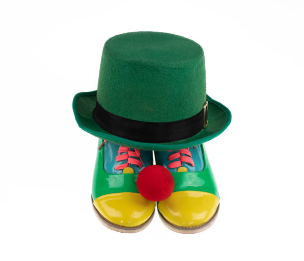 istock green clown hat and boots isolated on white background 1476264620