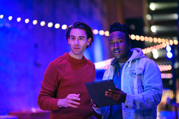 istock Young Men Using a Digital Tablet in a City at Night 1476265198