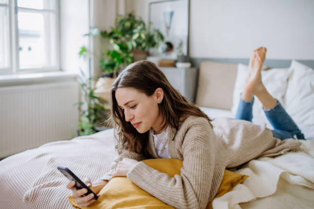 istock Young woman scrolling her smartphone in the apartment. 1476265242