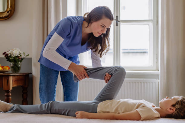 istock Little girl doing exercise with a nurse. 1476266910