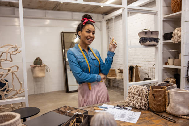 istock Cute young woman in an art studio looking joyful 1476267641